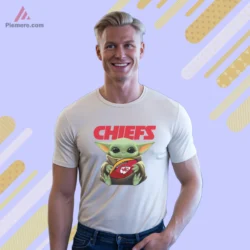 Baby Yoda Kansas City Chiefs Football Shirt with cute mascot holding a KC football